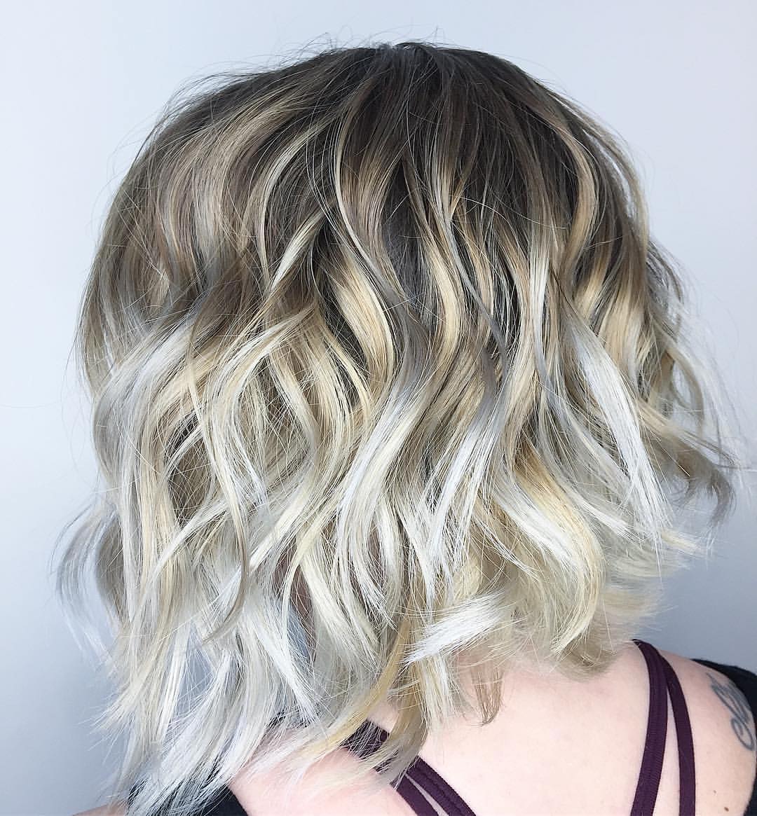 Curly Blonde Hairstyle with Silver Highlights